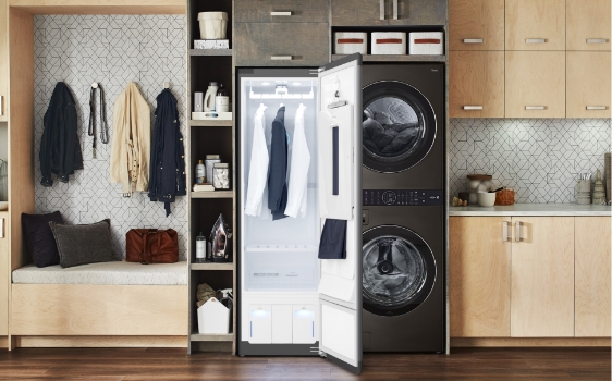 LG styler in a modern kitchen with 2 white shirts and a grey blazer inside. 